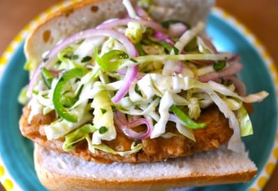 A Vegan Fried Chicken Sandwich topped with slaw.