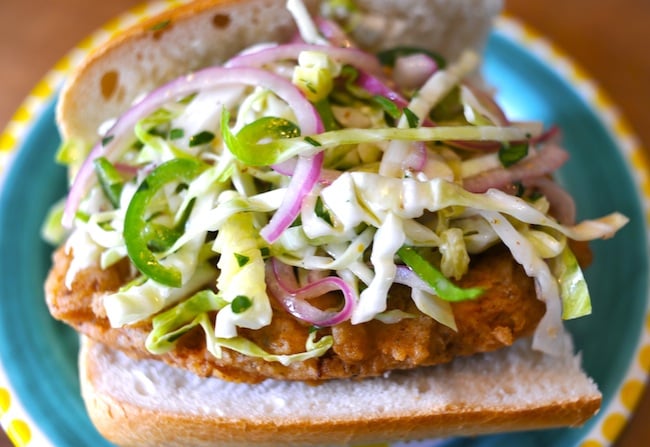 A Vegan Fried Chicken Sandwich topped with slaw.