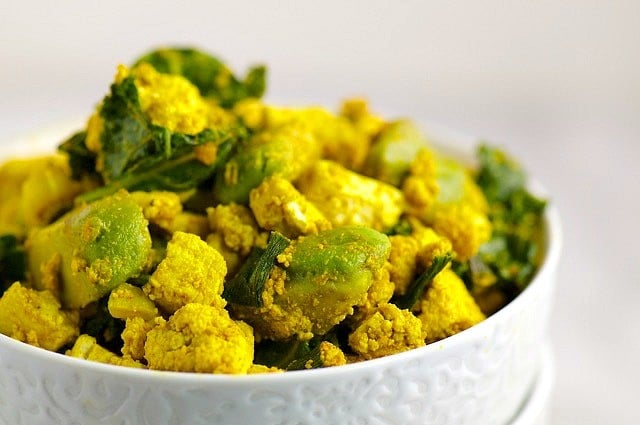 A bowl holds a generous portion of Avocado Kale and Tofu Scramble.