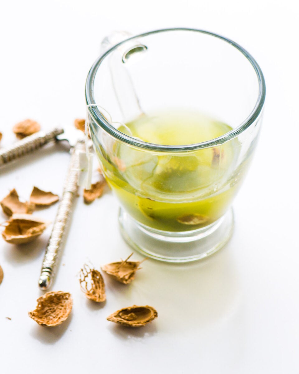 A photo of a mug holding a tea bag.