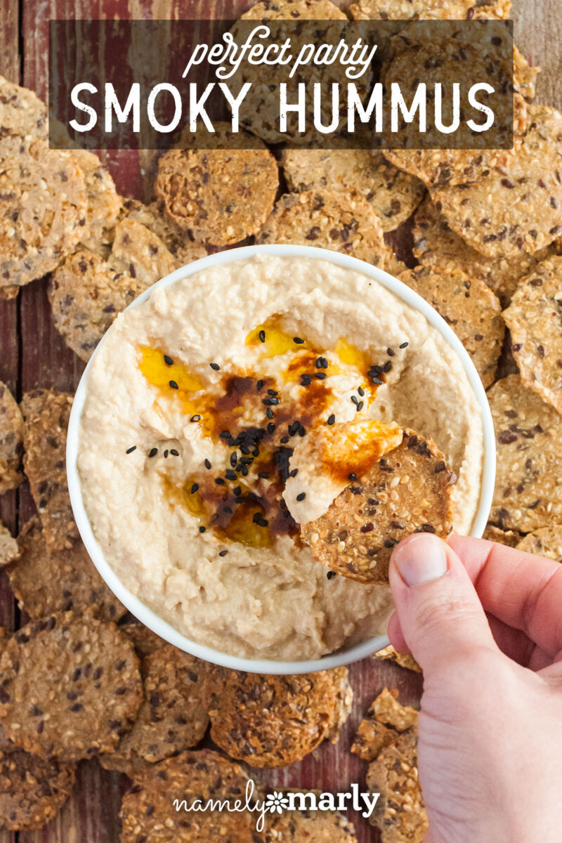 Looking down on a bowl of hummus with text that reads Perfect Party Smoky Hummus