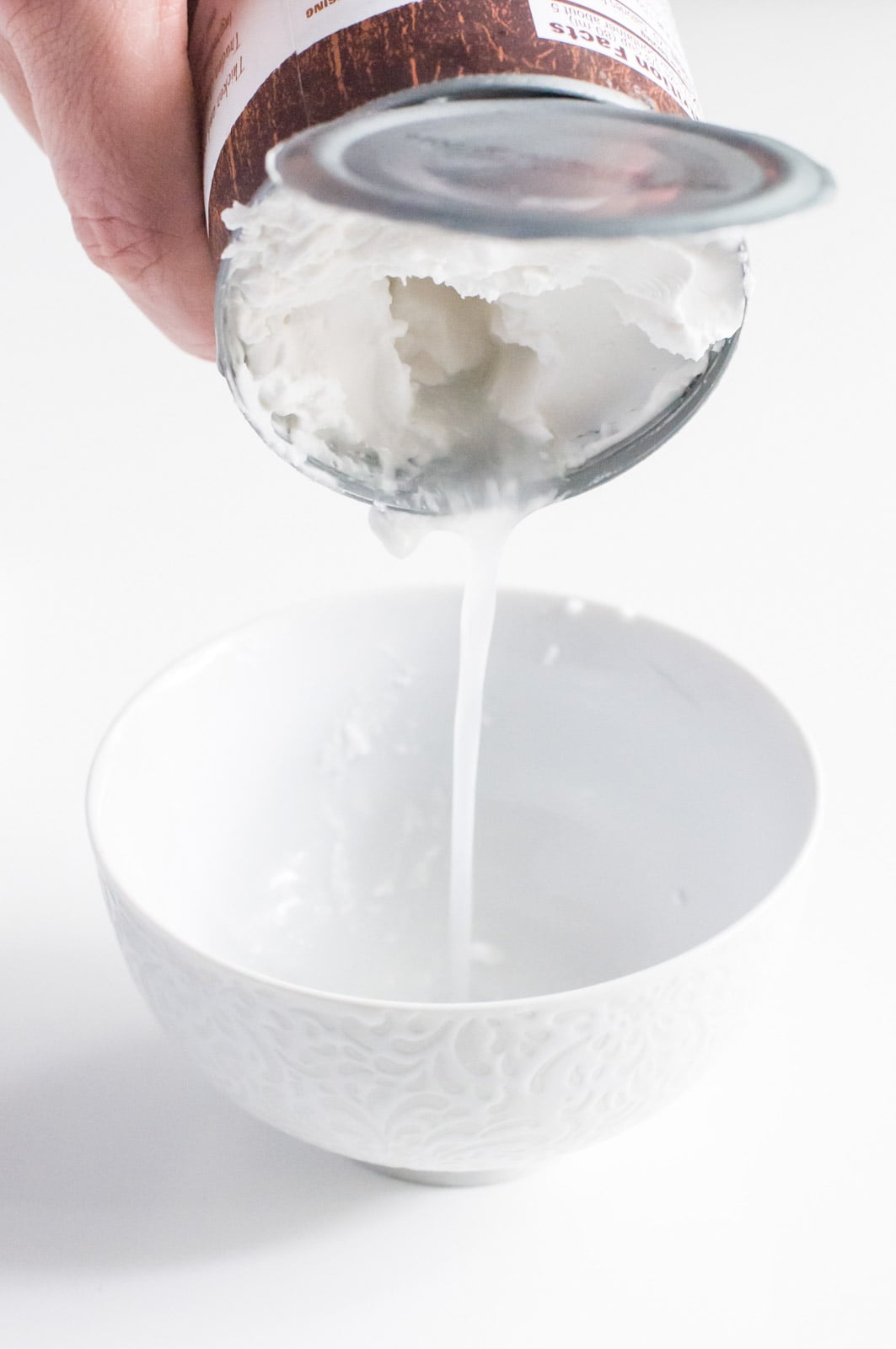 How to Make Vegan Coconut Whipped Cream: Refrigerate a can of coconut milk and then drain the milky substance at the bottom of the can