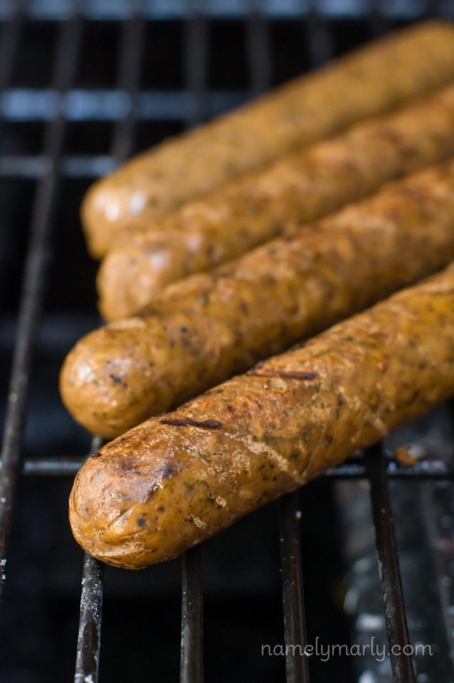 Several vegan brats on a grill.