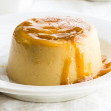 A closeup of vegan eggnog flan with caramel topping.