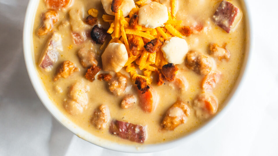 Looking down on a bowl of vegan cheesy soup.