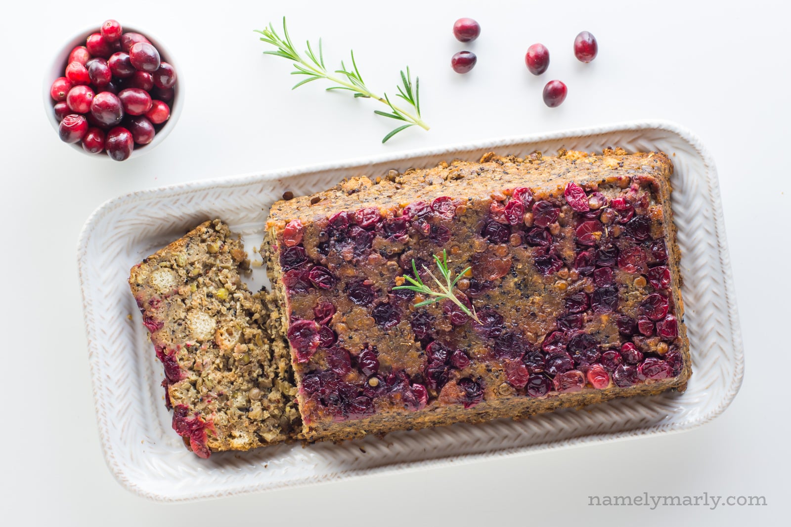 Overhead view of Vegan Holiday Lentil Loaf with stuffing and cranberries