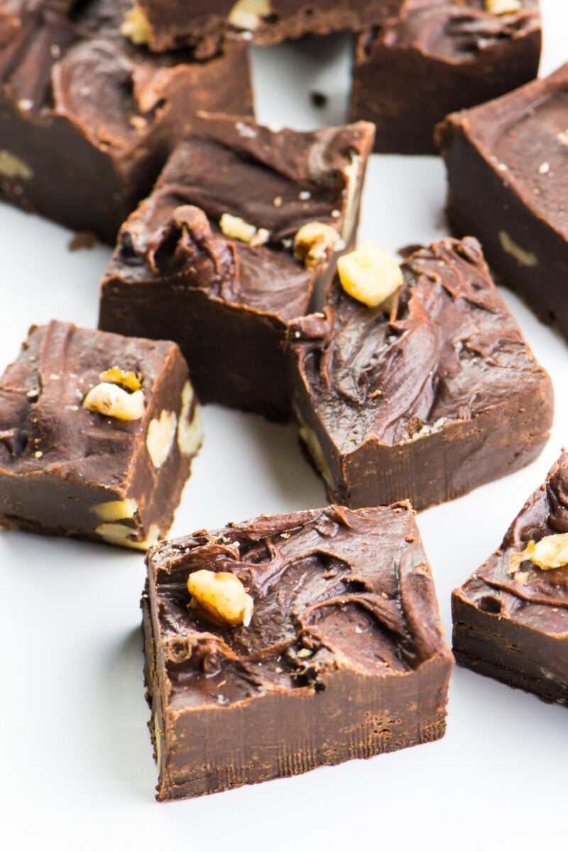Several pieces of chocolate sitting on a white counter.