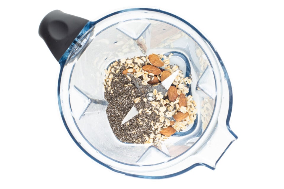 The ingredients to make the "blueberry milk" or sauce is in a blender.
