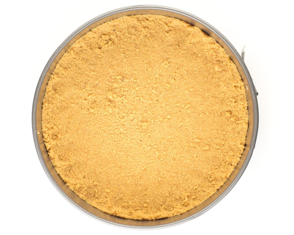 The crust has been pressed into the bottom of the pan.
