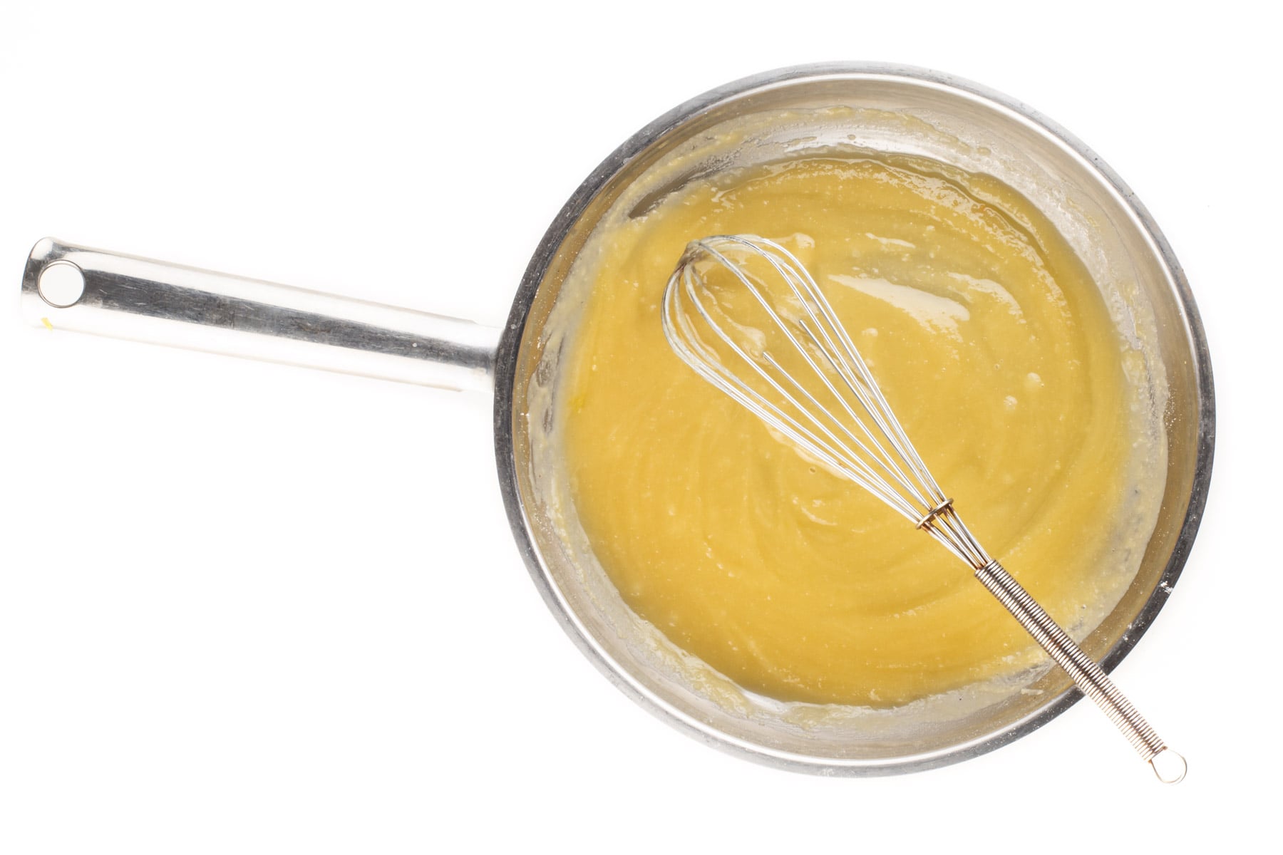 Vegan butter has been melted in a skillet and the flour has been added to create a roux.
