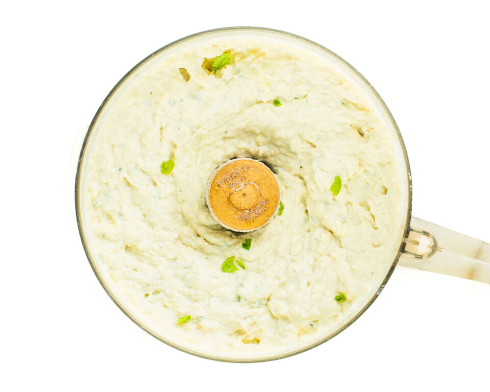 Making vegan ricotta in a food processor.