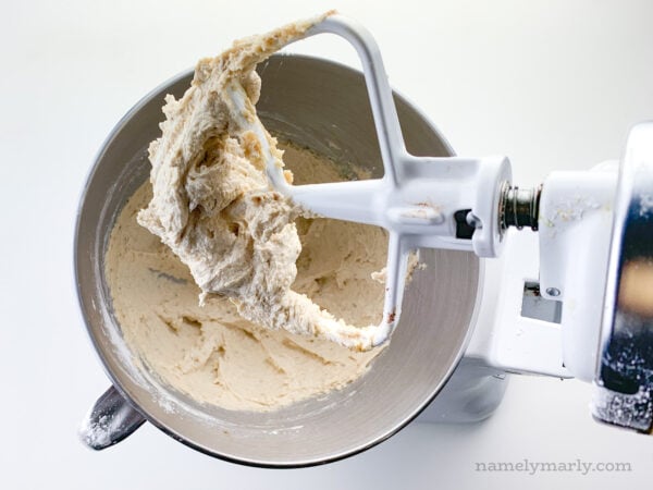 Looking down on a stand mixer full of creamed butter and sugar.