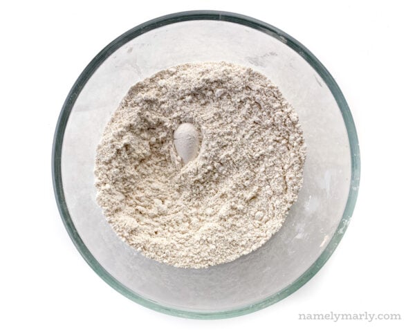 Looking down on a bowl with flour and other dry ingredients.