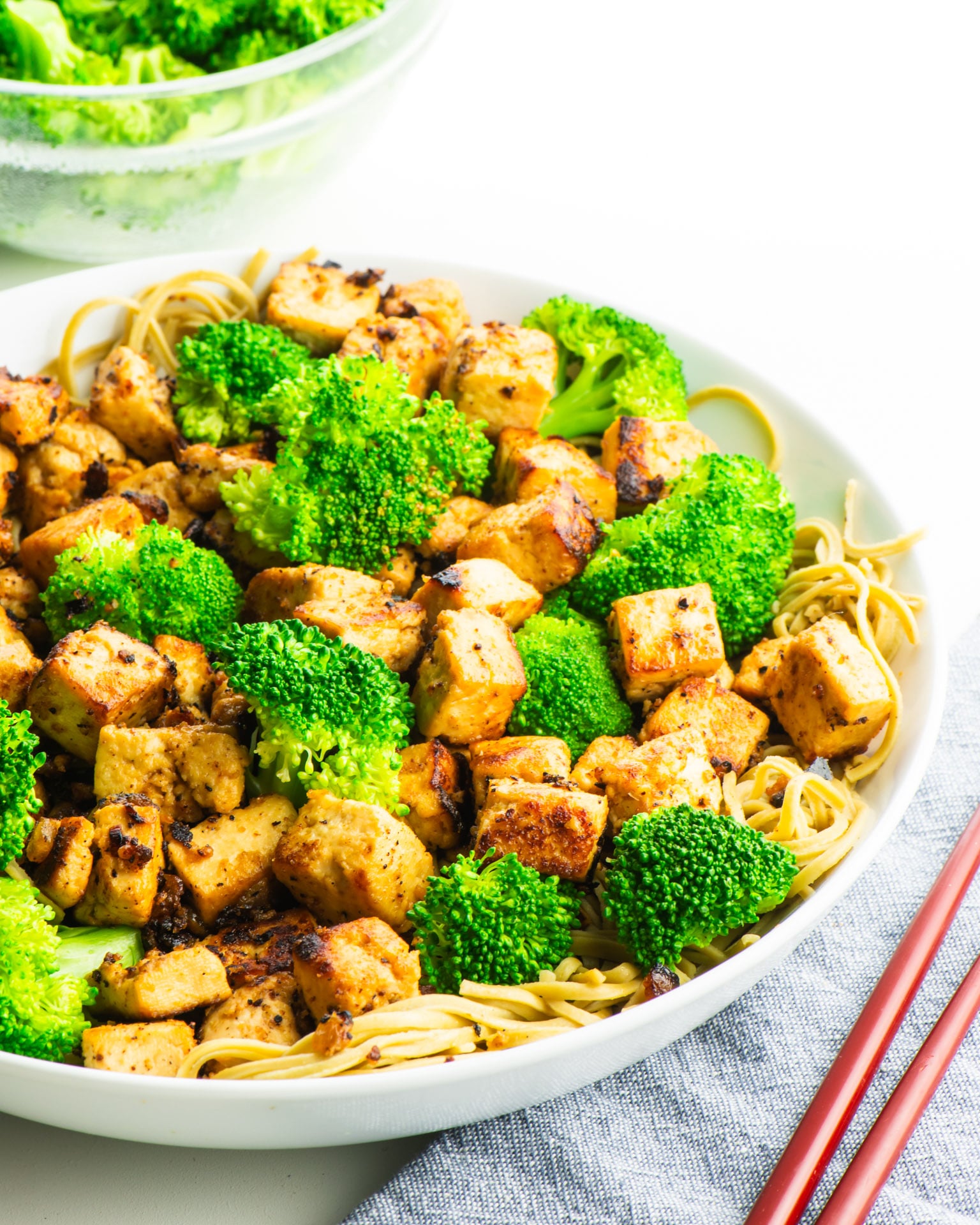 A rice bowl of miso tofu with steamed broccoli.