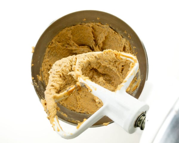 Looking down on a mixing bowl full of cookie dough batter.