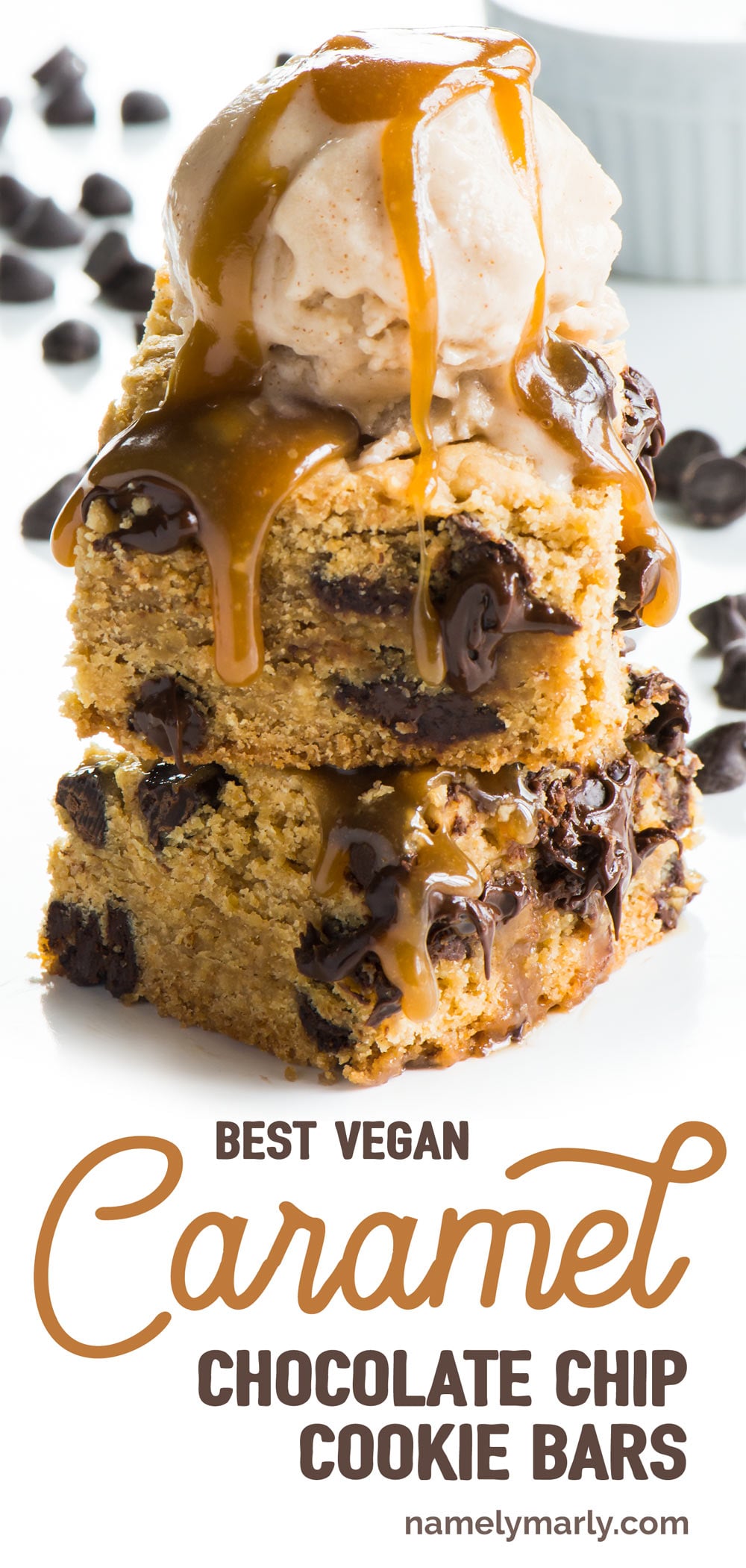 A salted caramel chocolate chip dessert bar has caramel drizzling down the sides. There are chocolate chips around the dessert.