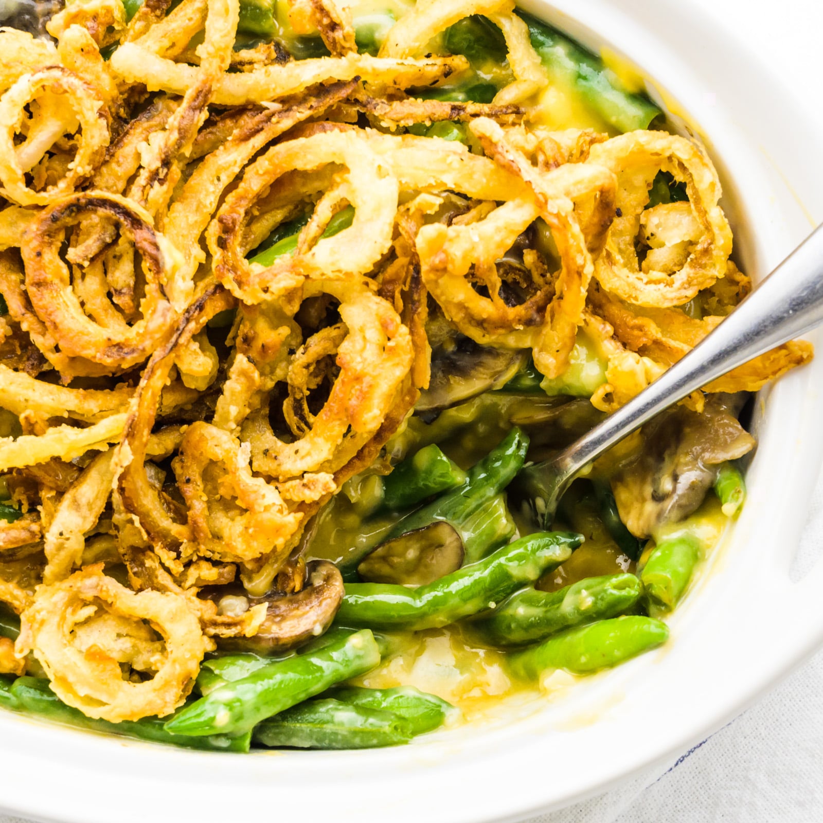 Looking down on a casserole dish full of green bean casserole.