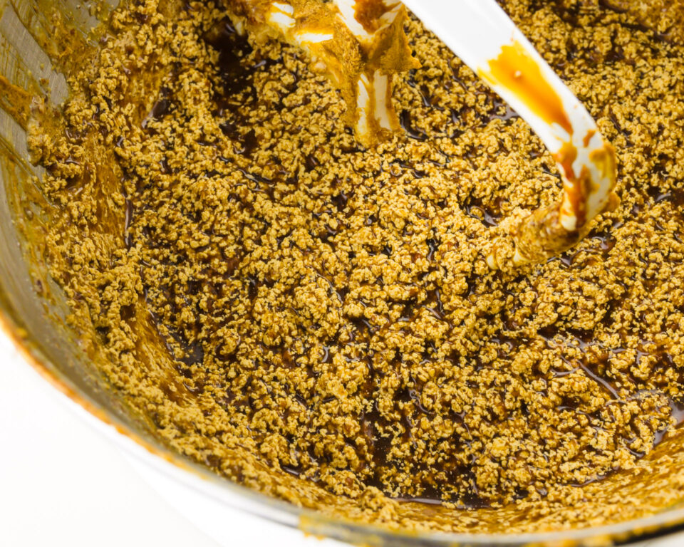 A close-up of gingerbread batter after the vinegar mix has been added, showing how the butter separates.