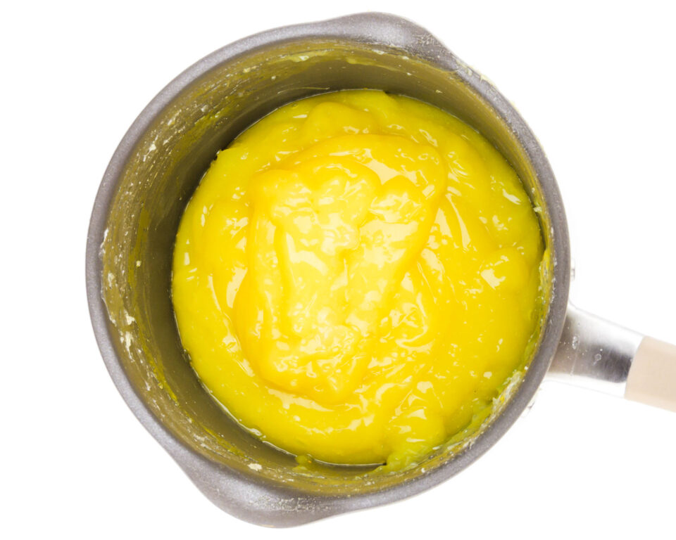 Vegan lemon curd in a saucepan.