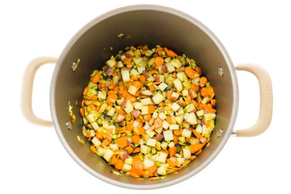 Looking down on a pot of veggies being cooked for soup.