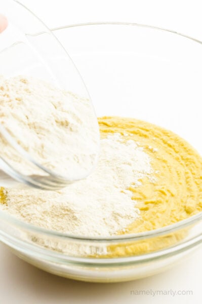 Vita wheat gluten powder is being poured in with a wet mixture.