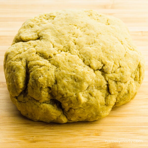 A loaf made from vita wheat gluten sits on a cutting board.