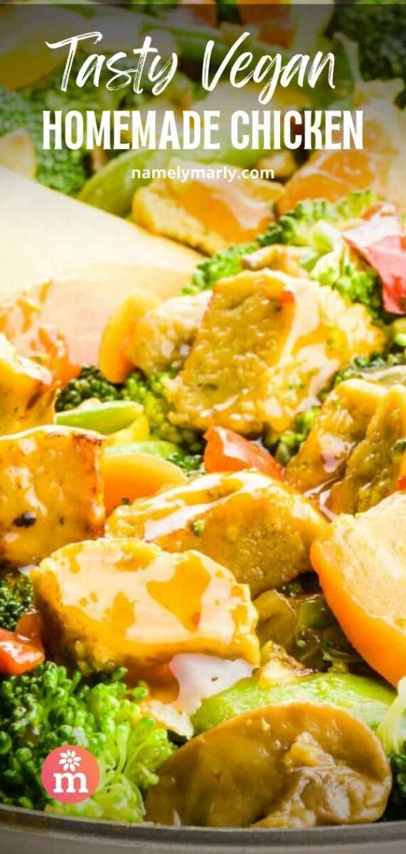 A spatula turns vegan chicken pieces in a skillet with sauce and vegetables. The text reads, Tasty Vegan Homemade Chicken.