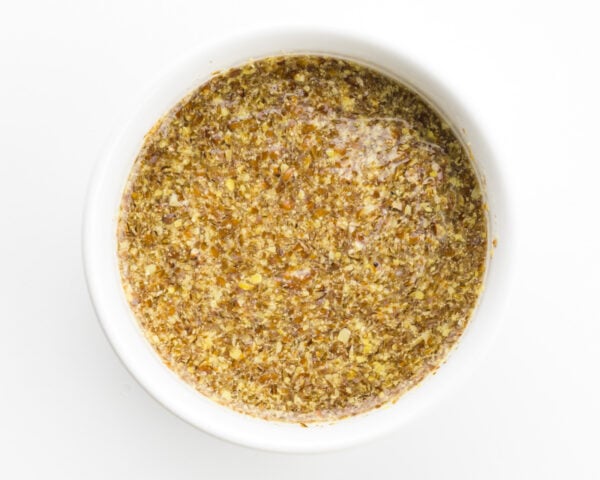 Looking down on a bowl with a flax egg in it.