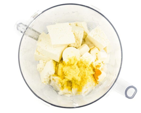 Ingredients are in a food processor bowl.