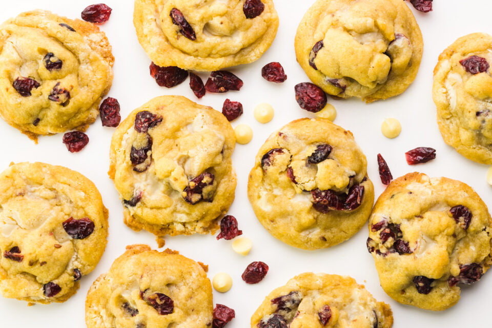 Looking down on several cookies on a white counter.