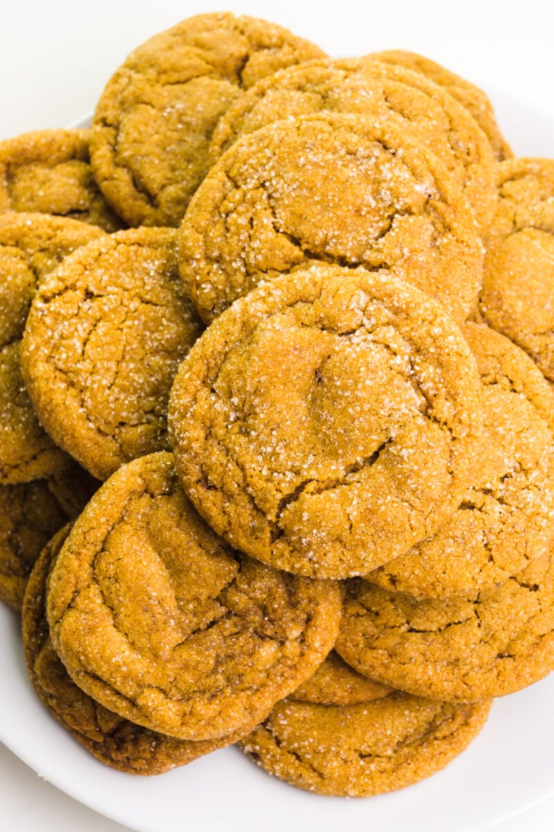 Looking down on a plate full of ginger cookies.