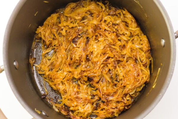 Looking Into a pot to see caramelized onions in the bottom.