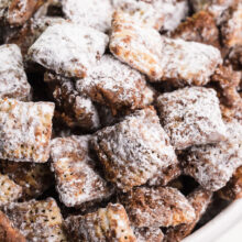 A close-up shot of vegan puppy chow, chocolate-covered cereal mixture, otherwise known as muddy buddies.