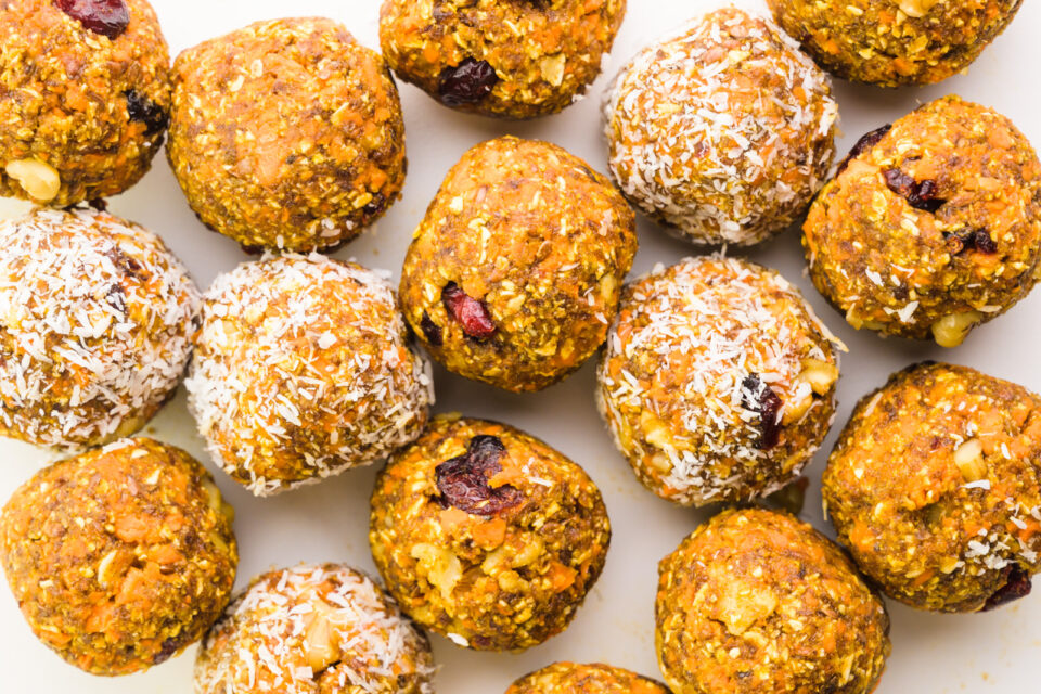 Looking down on a tray full of carrot cake energy bites.