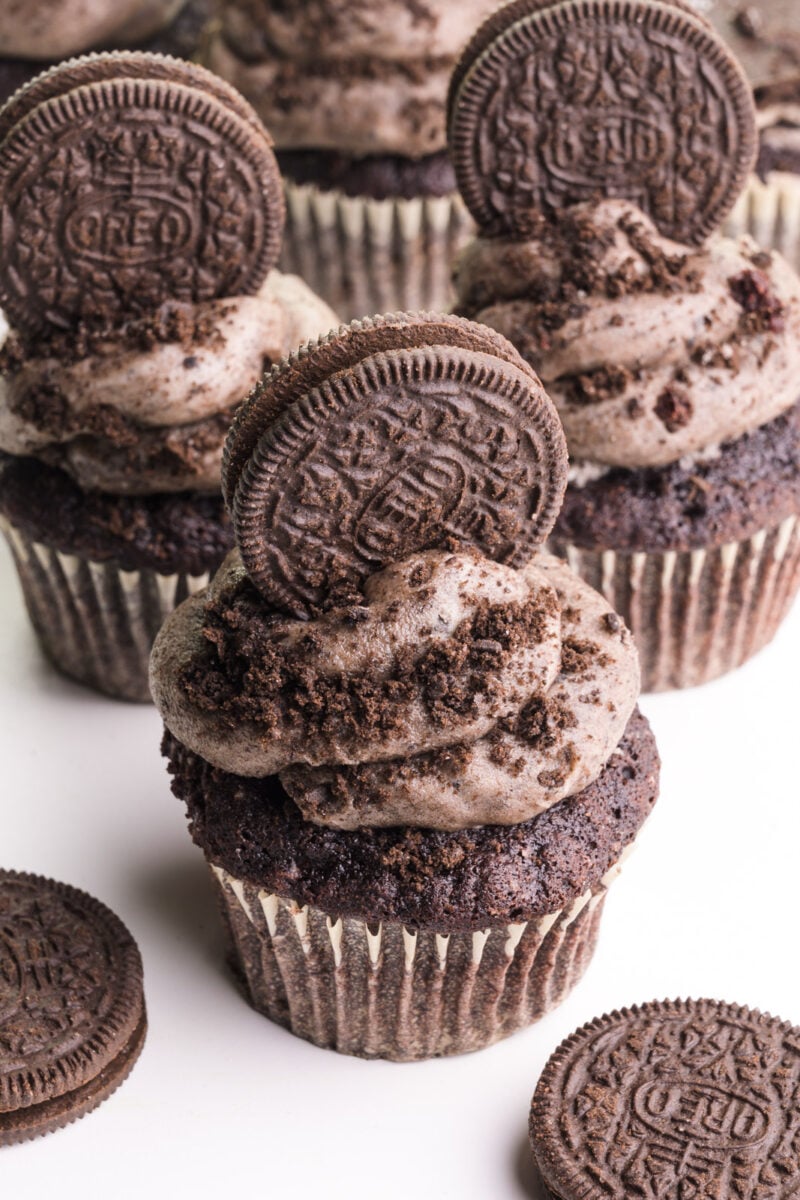 Looking down on cupcakes with Oreo frosting on top and Oreo cookies added.