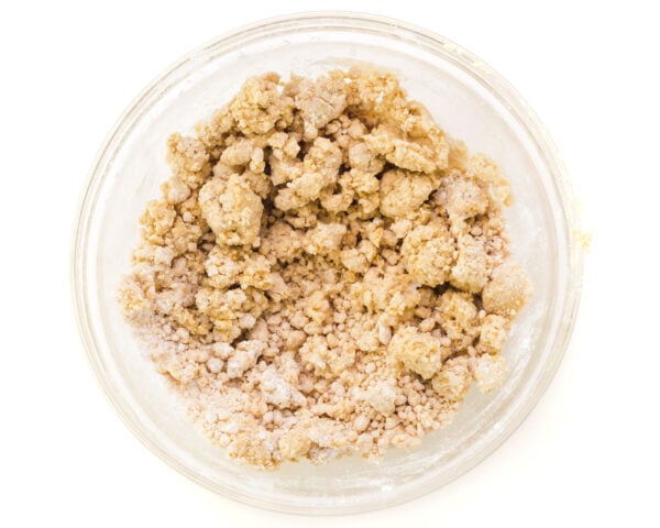 Looking down on a bowl with a crumbly peanut butter mixture in it.