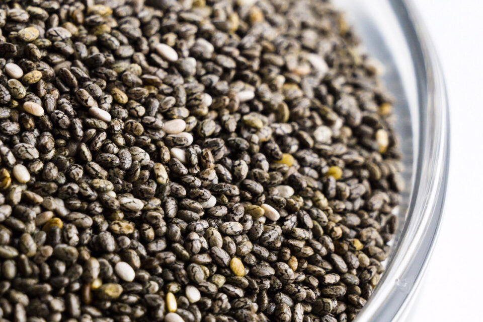 Closeup of a bowl full of chia seeds.