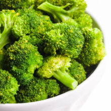 A bowl of steamed broccoli.