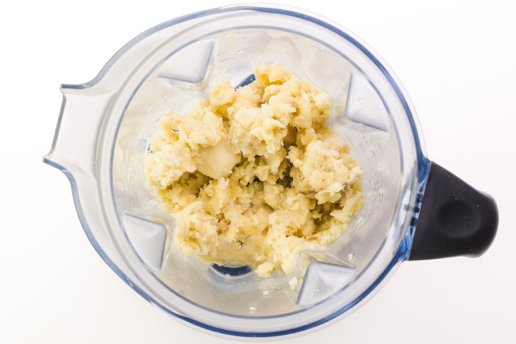 Frozen bananas have been pulsed in a blender, leaving lots of texture.