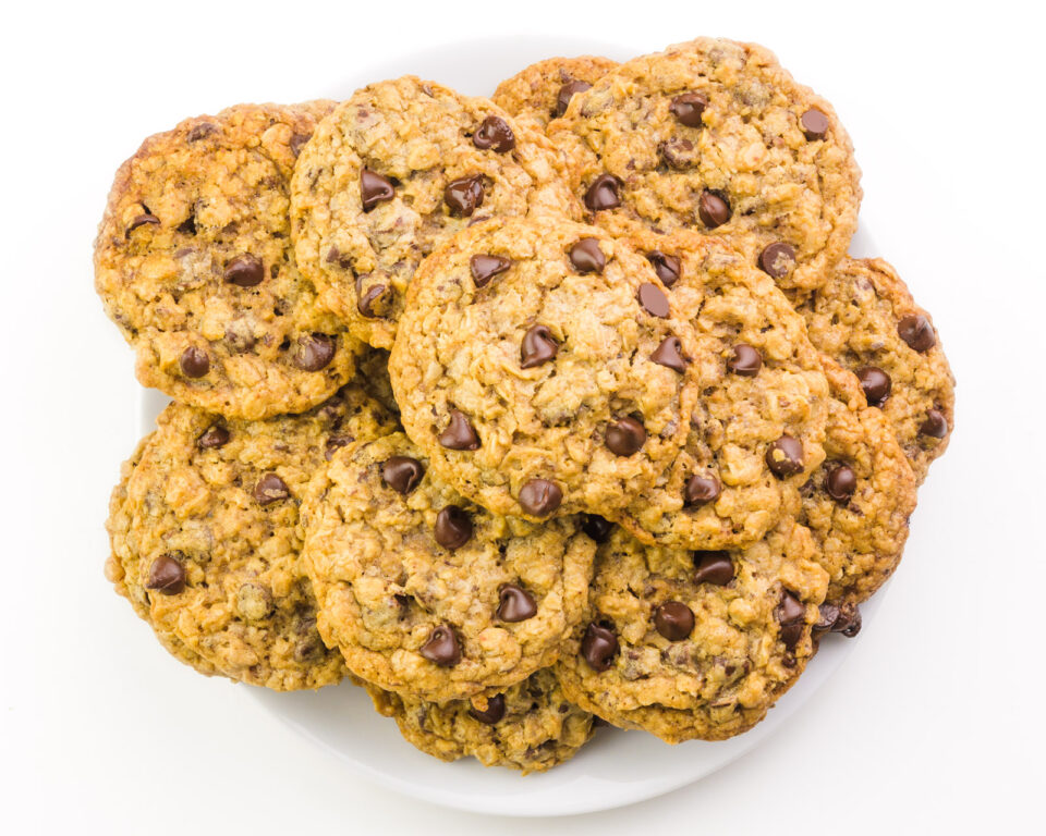 Looking down on a plate full of oatmeal chocolate chip cookies.