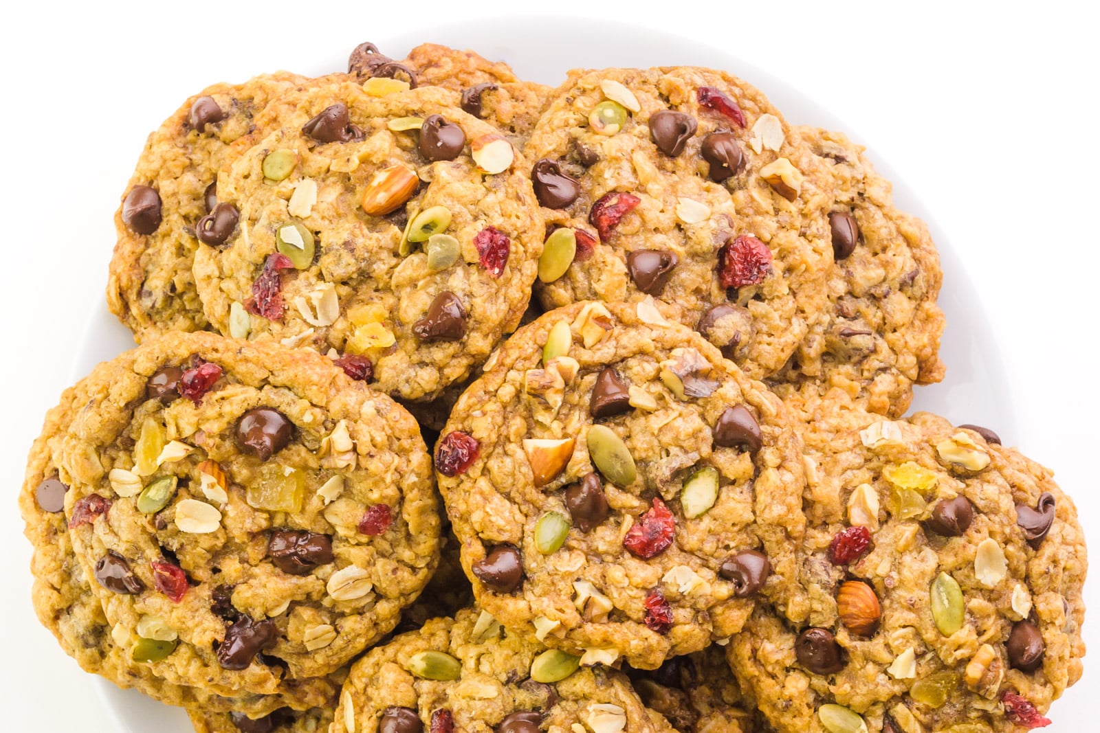 Looking down on a plate full of trail mix cookies.