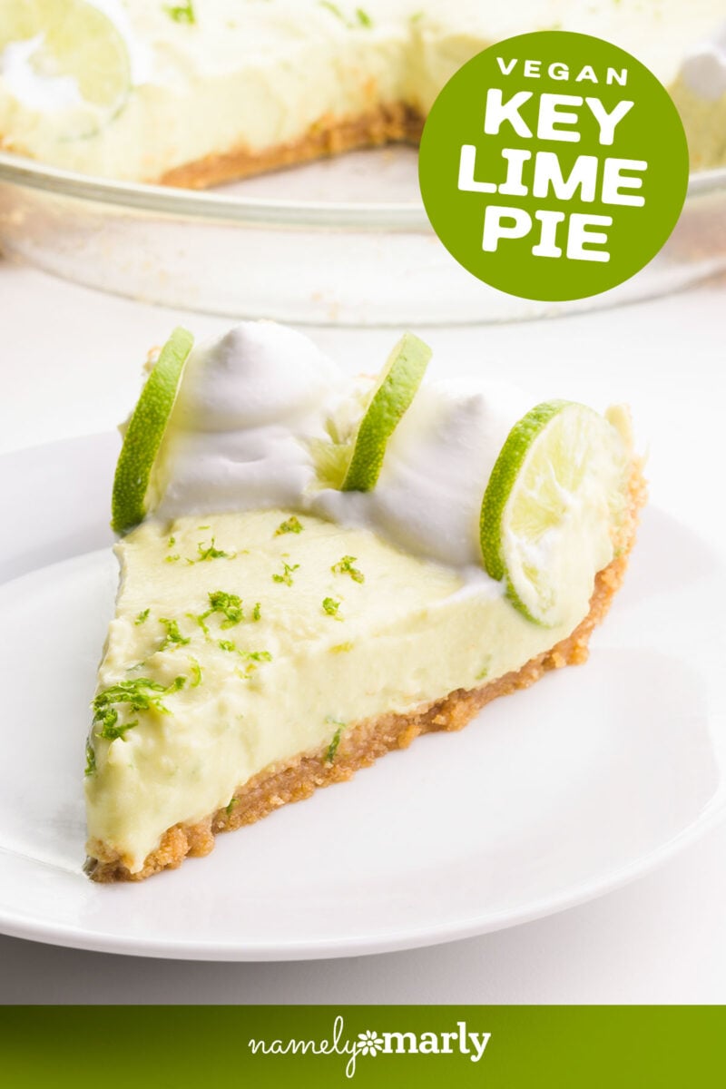 A slice of vegan key lime pie sits on a plate. There is whipped cream and lime slices on the pie. Text reads vegan key lime pie