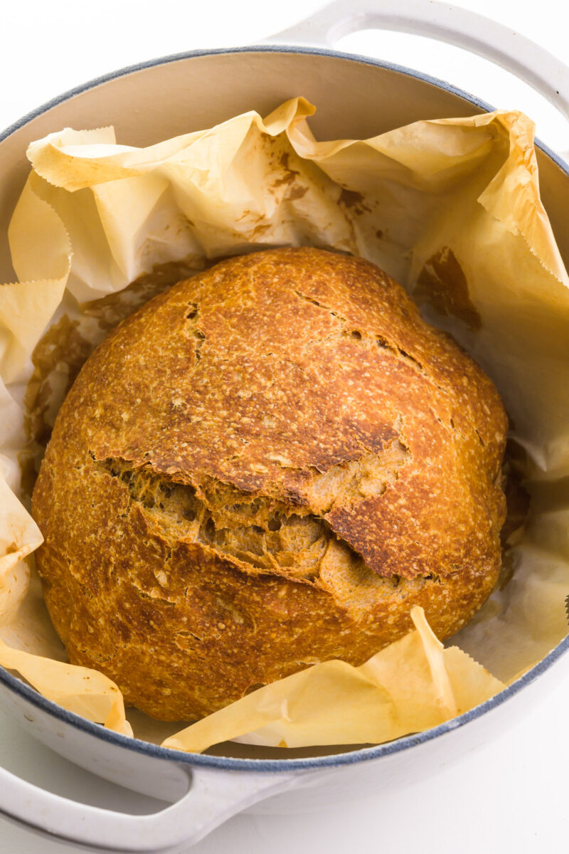 Looking down on a loaf of no-knead bread in a pan.
