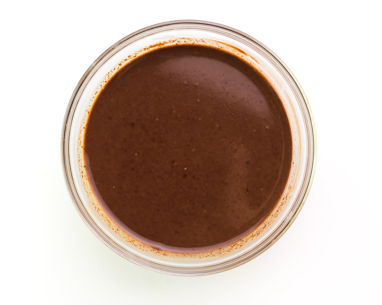 Looking down on a bowl full of melted chocolate.