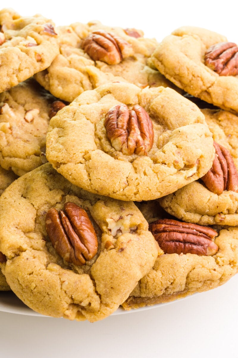 Looking down on a plate full of vegan pecan cookies.