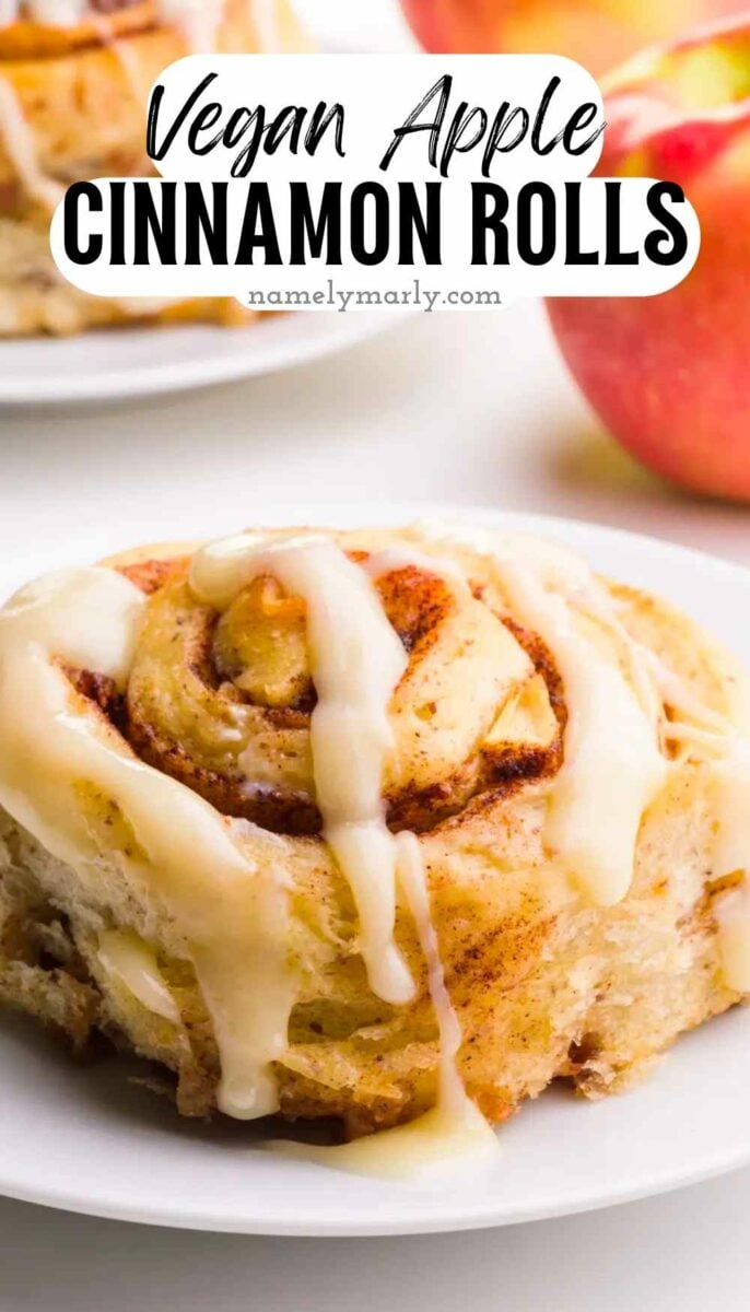 A closeup of a cinnamon roll on a plate. The text reads, Vegan Apple Cinnamon Rolls.