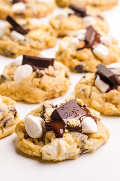 Several vegan s'mores cookies sit on a white countertop.