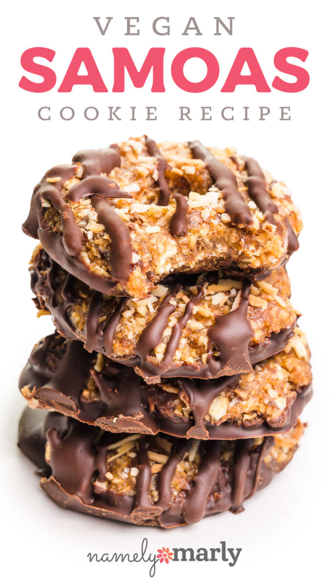 Stack of vegan Samoas cookies drizzled with chocolate and topped with coconut flakes on a white background.