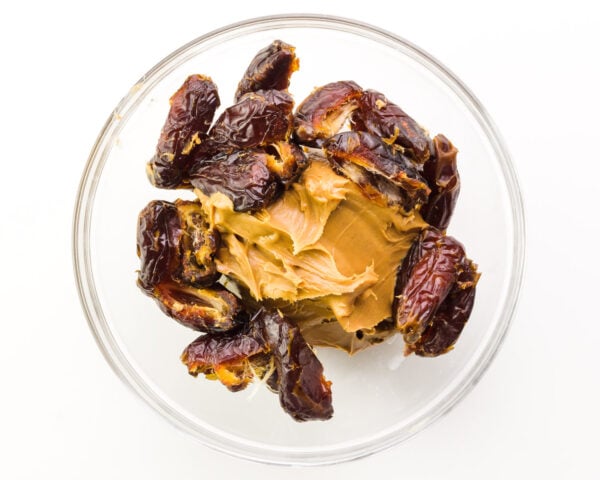 Dates and peanut butter are in a bowl.