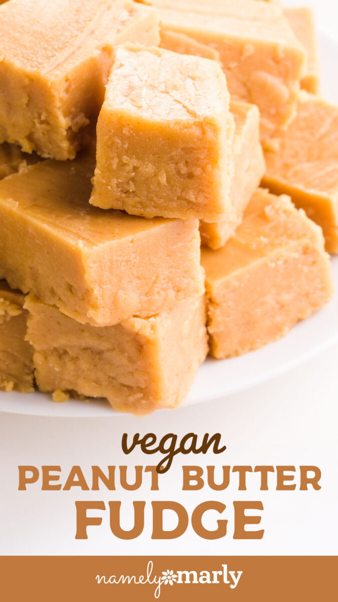 Creamy vegan peanut butter fudge squares stacked on a white plate.